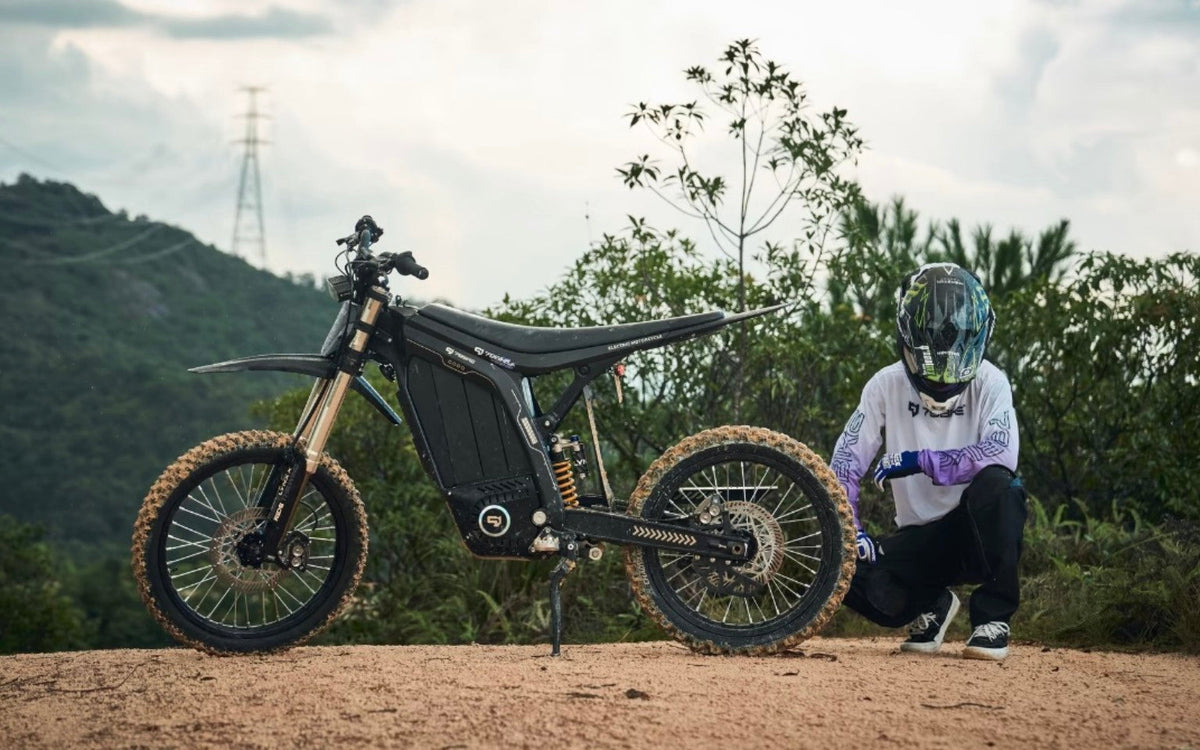 79BIKE Lynx electric dirt bike with rider on a mountain trail
